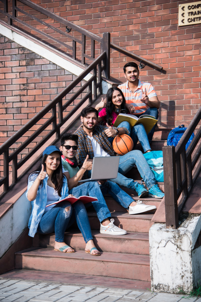 Students studying together on college steps